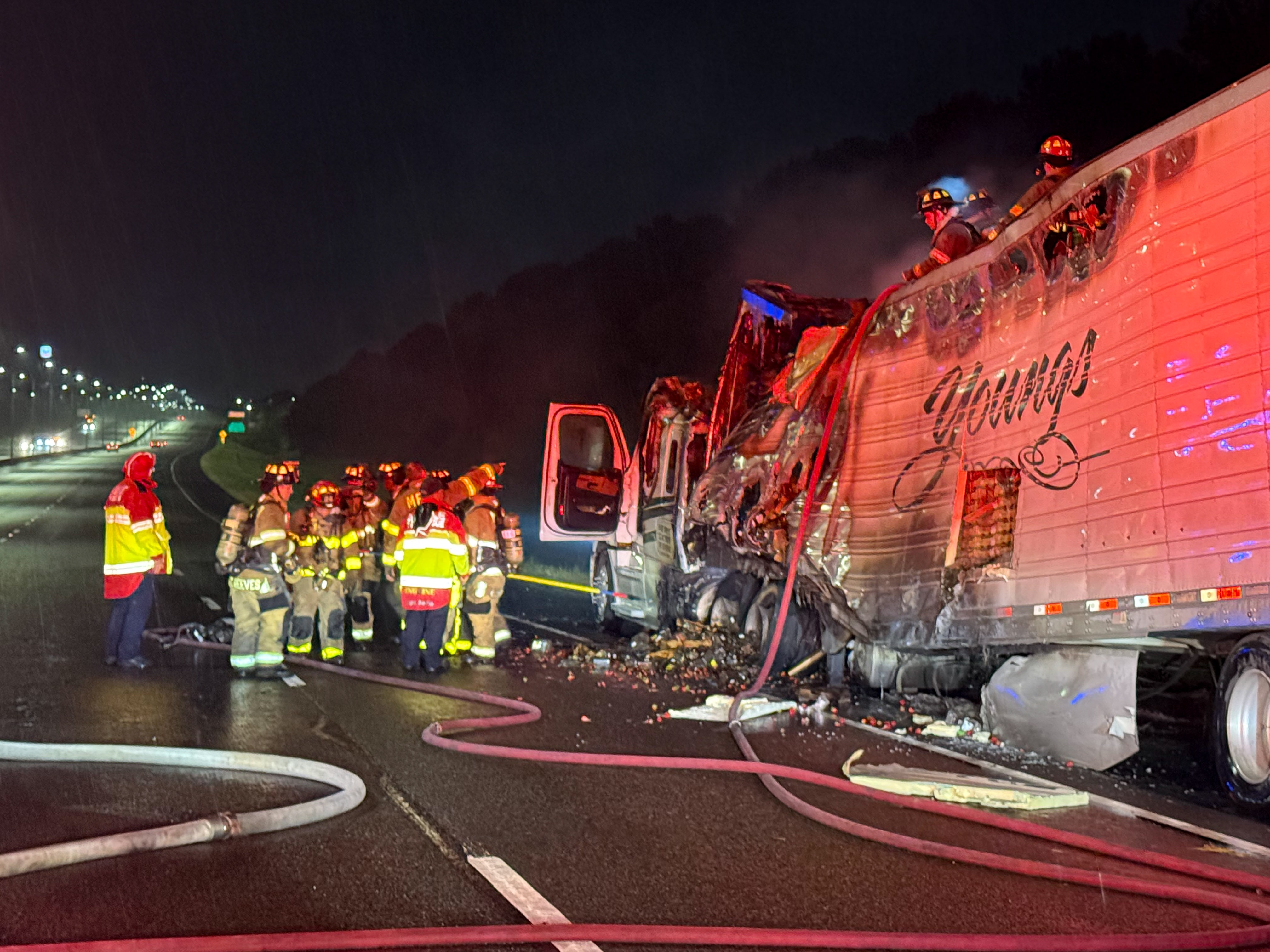 Firefighters extinguish truck fire
