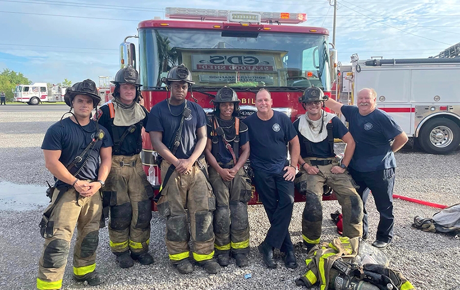 fire fighters in front of fire truck