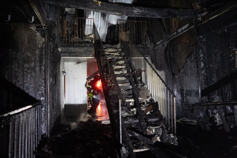 Investigator Looks Over Aftermath of Montlimar Apartments Fire