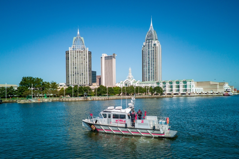 MFRD Fire Boat 2 in front of City of Mobile skyline.