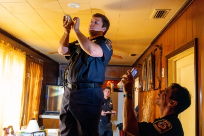 Firefighters installing smoke alarms