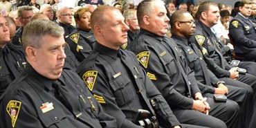 police offices sitting in conference meeting